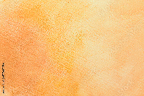 Abstract mixed gradient brown, orange and yellow watercolor on paper. The color splashing in the paper. It is a hand drawn.