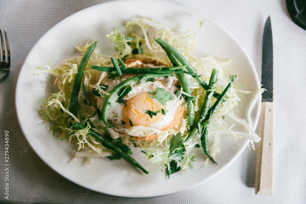 close up of egg and green been salad close up of egg and green been salad