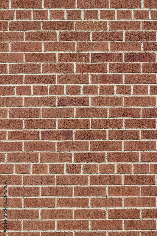 Modern brown color brick wall background with weathered rough texture bricks in a common bond brickwork pattern Modern brown color brick wall background with weathered rough texture bricks in a common bond brickwork pattern