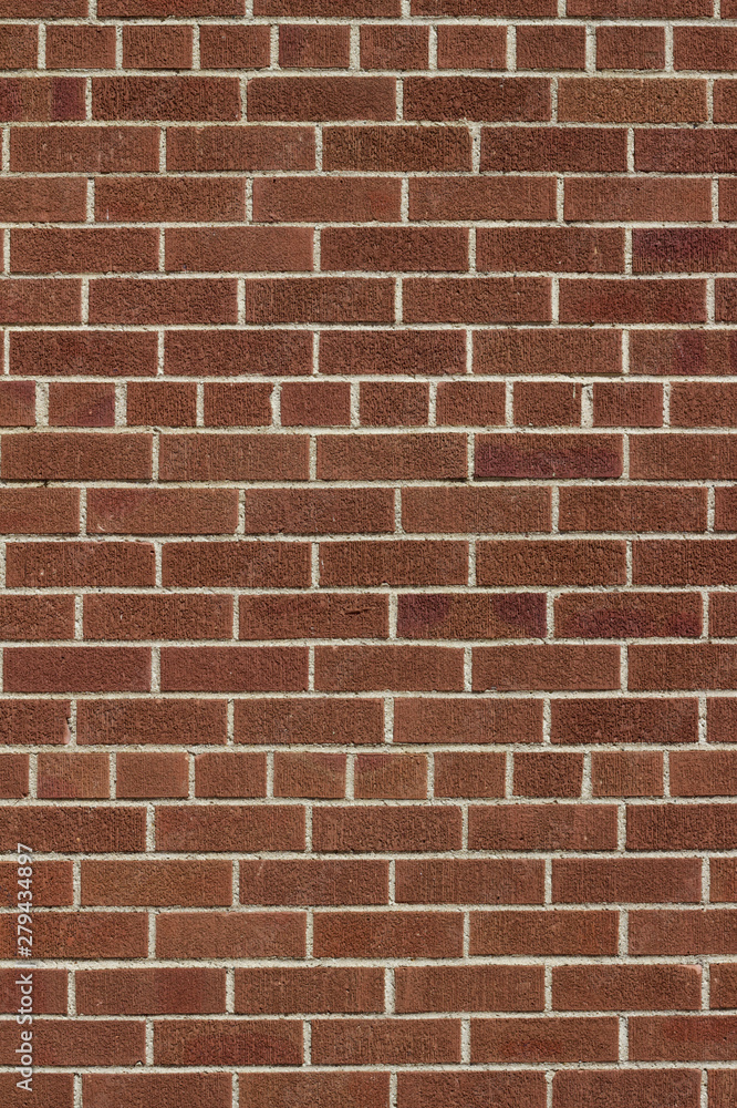 Modern brown color brick wall background with weathered rough texture bricks in a common bond brickwork pattern Modern brown color brick wall background with weathered rough texture bricks in a common bond brickwork pattern