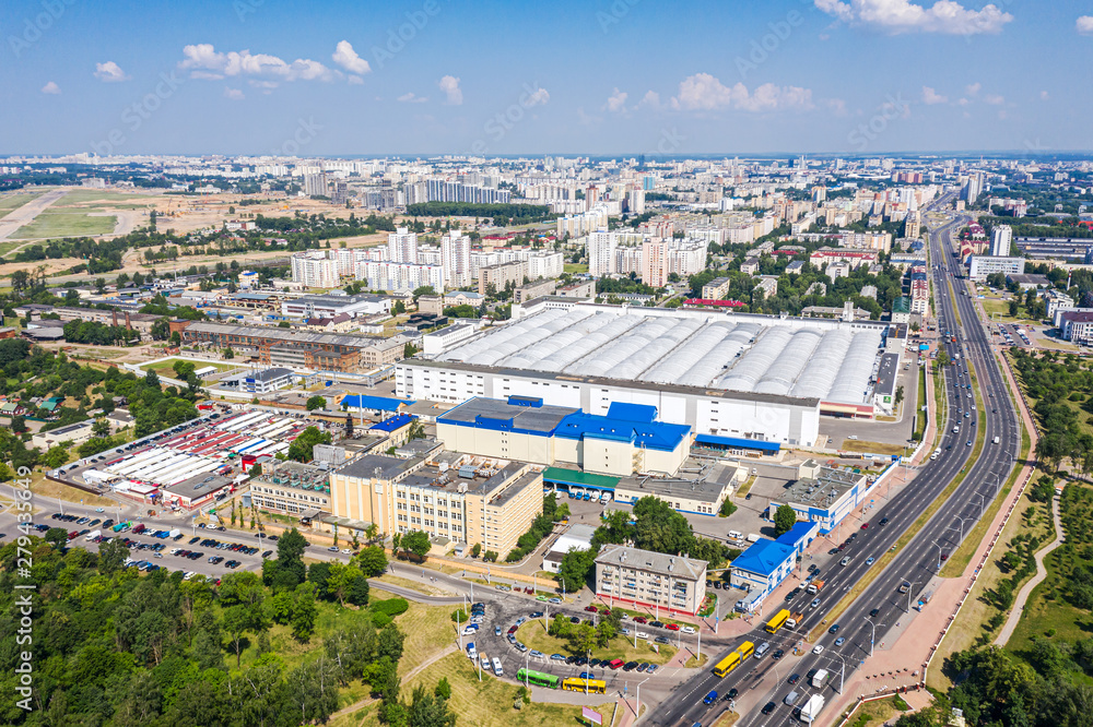 Fototapeta premium aerial view of urban industrial district with factory buildings and warehouses. Minsk, Belarus