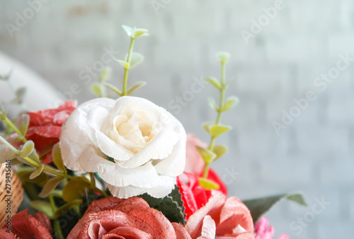 White and red artificial rose