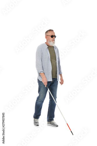 Mature blind person with long cane walking on white background