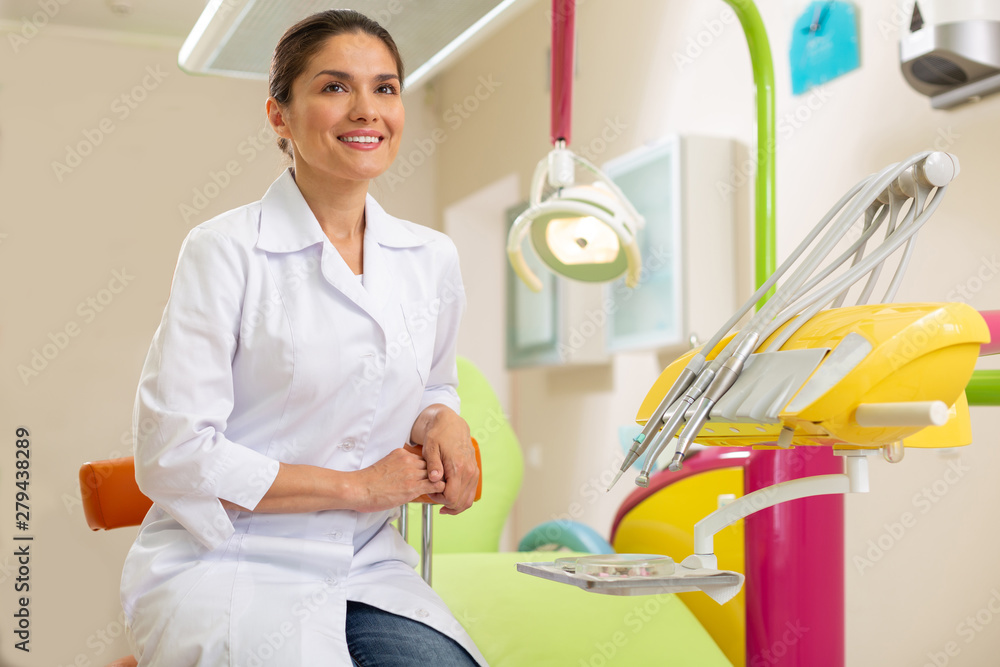 Fototapeta premium Smiling female doctor looking in front of her