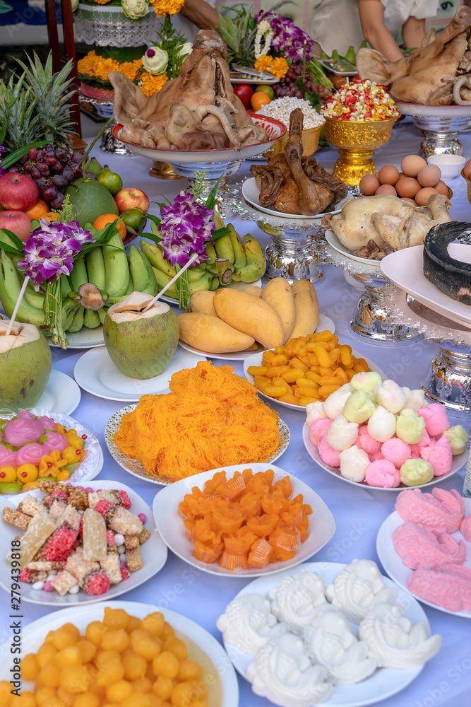 Sacrificial offering food for pray to god and memorial to ancestor, Bangkok, Thailand. Traditional offerings to gods with food, vegetable and fruit for the gods of Thai culture