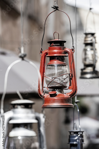 Decorative kerosene lamps hang on the street near the cafe in Lviv, Ukraine