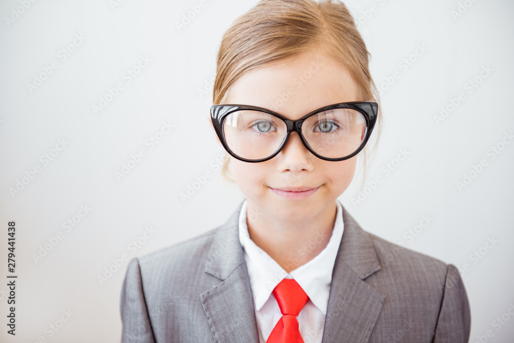 Happy business girl in big glasses and fashionable suit. Feminism, business woman concept
