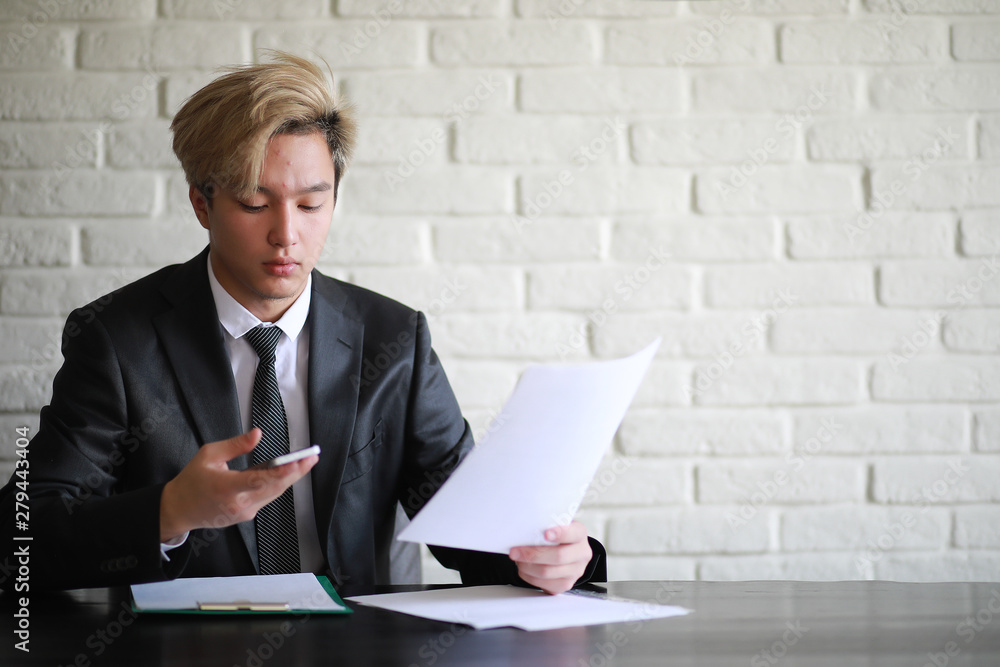 Young Asian businessman in white shirt and tie Young Asian businessman in white shirt and tie