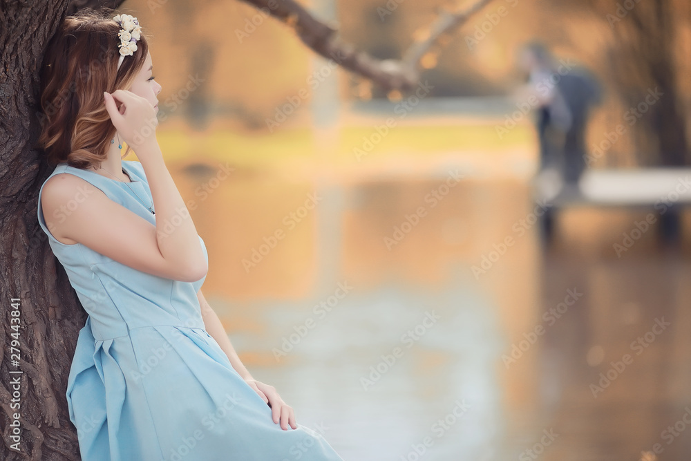 Young girl on a walk in the autumn