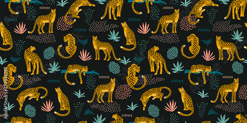 Vestor seamless pattern with leopards and abstract tropical leaves.
