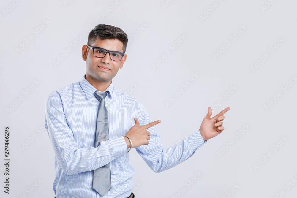 Young Indian man Showing direction with hand Young Indian man Showing direction with hand