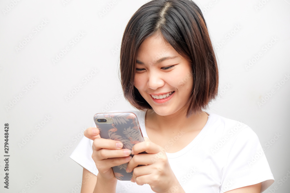 Beautiful women typing text smartphone on white background Beautiful women typing text smartphone on white background