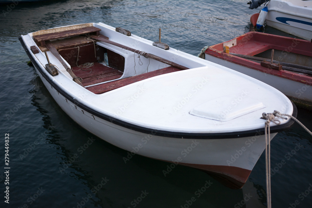 Anchored boat in the harbor on the Adriatic Sea. Anchored boat in the harbor on the Adriatic Sea.