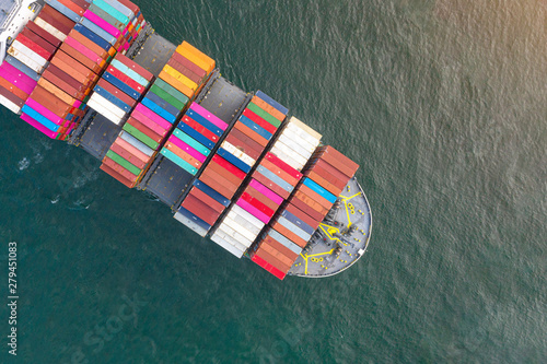 top aerial view of bulk head of containers ship sailing in the sea, carriage the shipment from loading port to destination discharging port, transport and logistics services to worldwide