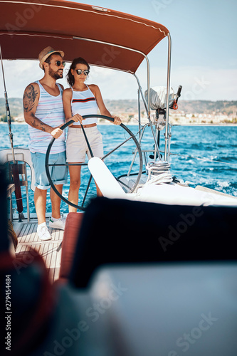 Happy couple having fun on a boat trip. © luckybusiness