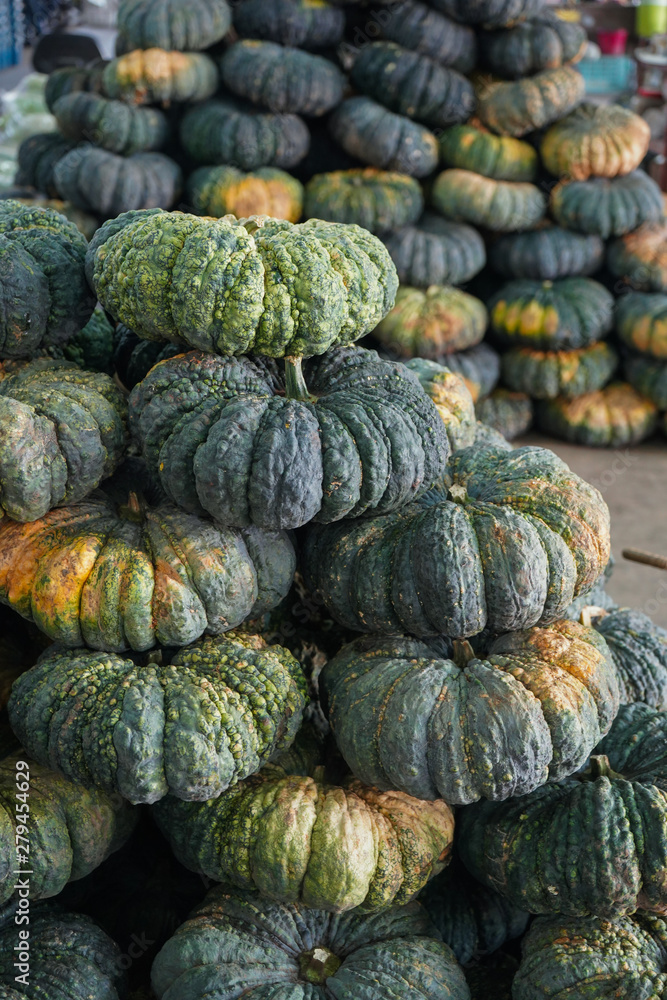 green pumpkins store at a market green pumpkins store at a market
