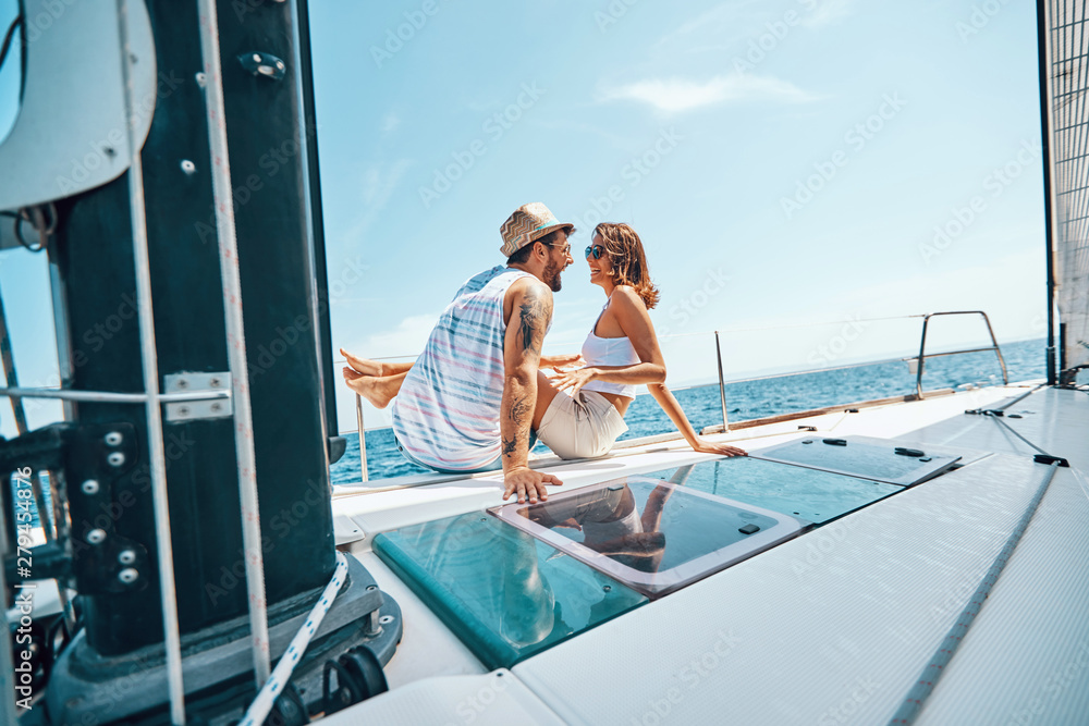 Young couple on boat - Cruise ship holiday travel vacation tourists.
