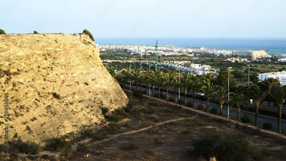 Cliff and city coast views at sunset. Almerimar, Almeria, Spain Cliff and city coast views at sunset. Almerimar, Almeria, Spain