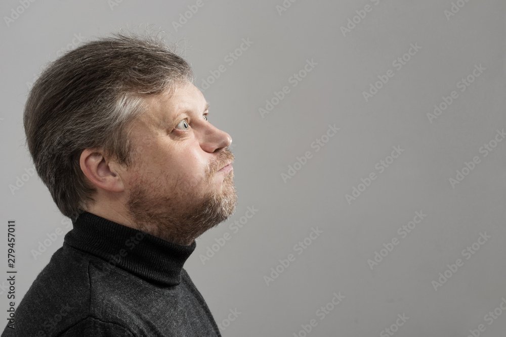 Fototapeta premium funny mature man on gray background