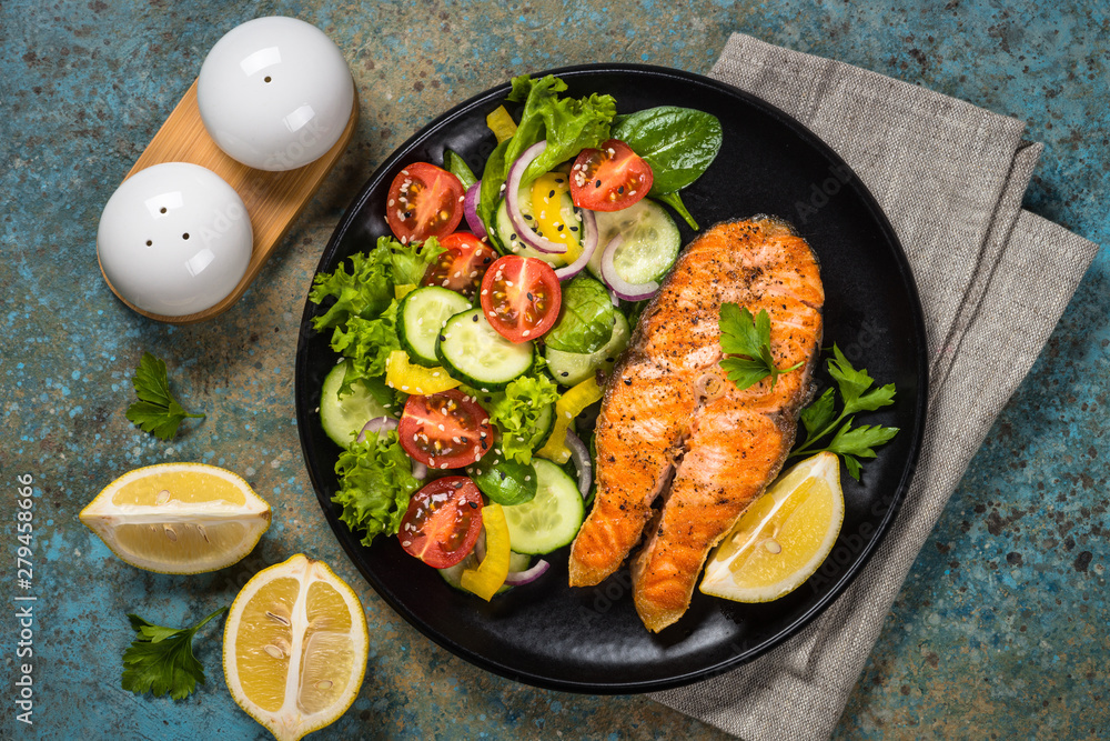 Grilled salmon fish steak with vegetables. Grilled salmon fish steak with vegetables.