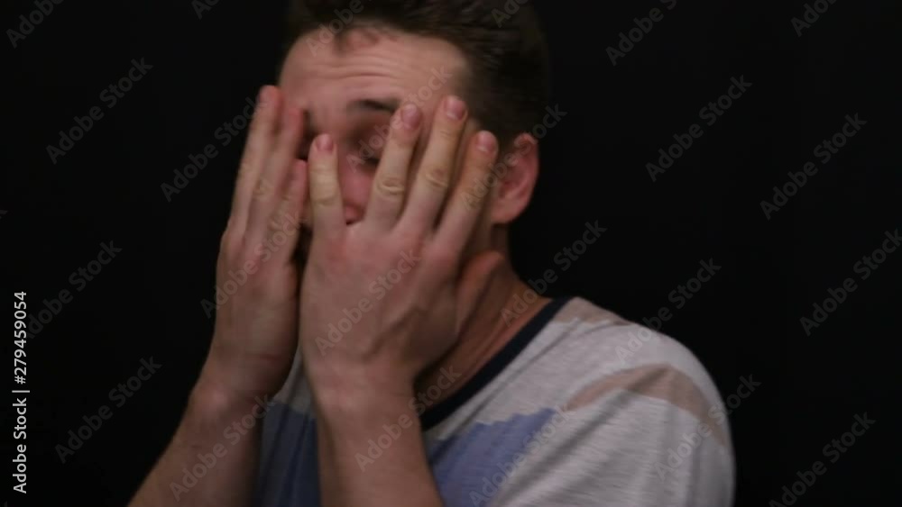 fearful young handsome caucasian man shows his emotion close-up fearful young handsome caucasian man shows his emotion close-up