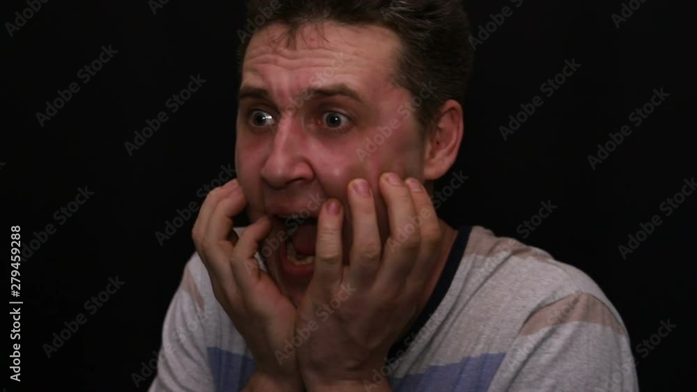 fearful young handsome caucasian man shows his emotion close-up fearful young handsome caucasian man shows his emotion close-up