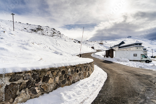 Road in ski resort of Sierra Nevada in winter, full of snow.