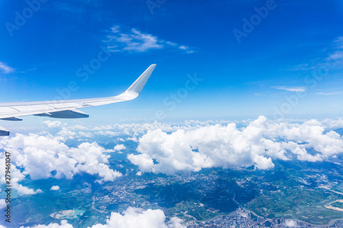 Airplane wing close-up flying in Shenzhen at high altitude
