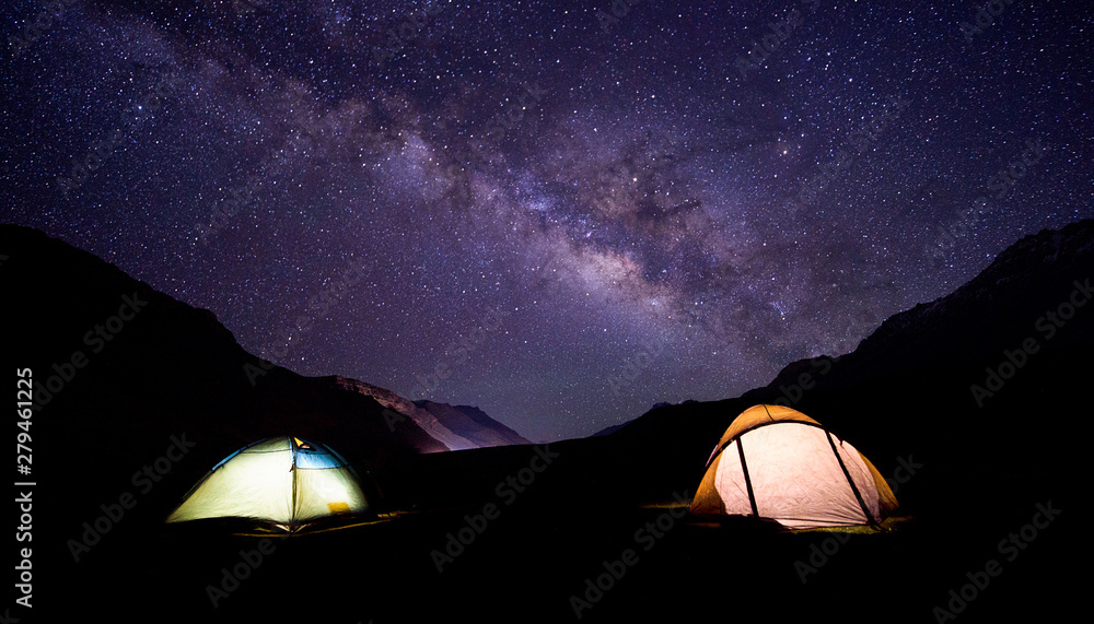camping under milkyway with twinkling stars in the background camping under milkyway with twinkling stars in the background