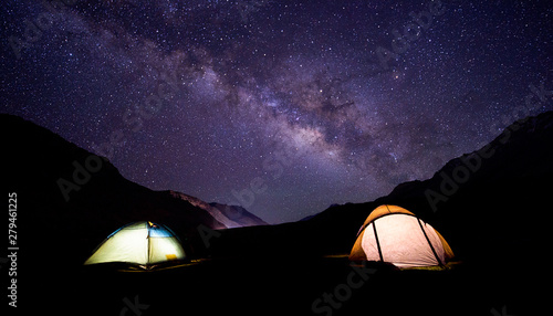 camping under milkyway with twinkling stars in the background 