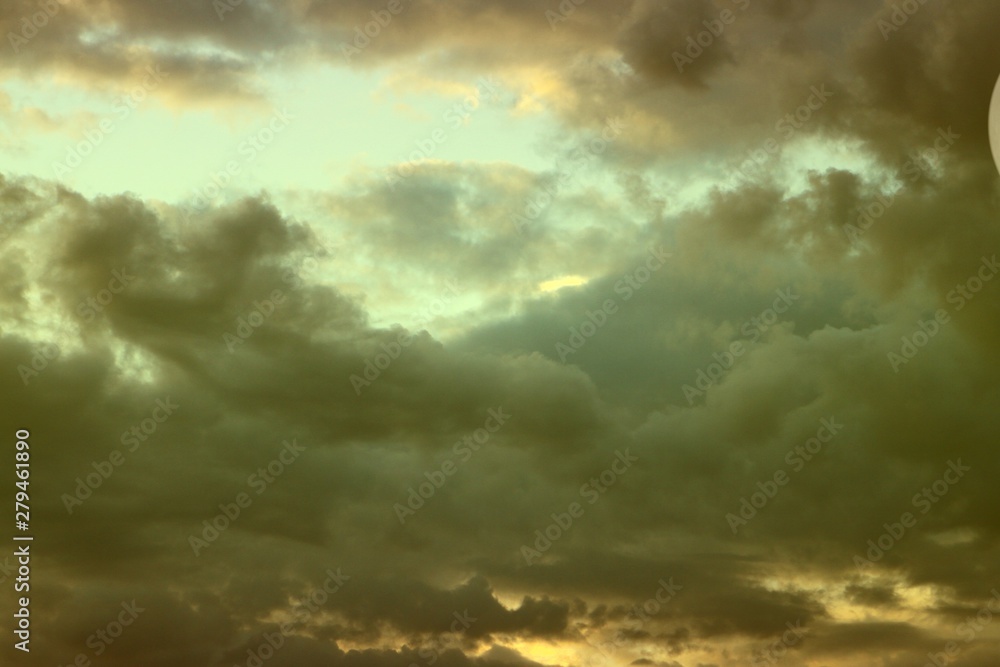 Obraz premium amazing unreal colorful fantasy sun colored partially cloudy sky for using in design as background.