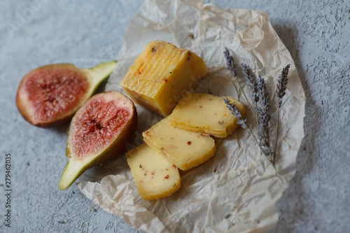 Fototapeta food photo rustic Breakfast cheese and figs and lavender in Provence style