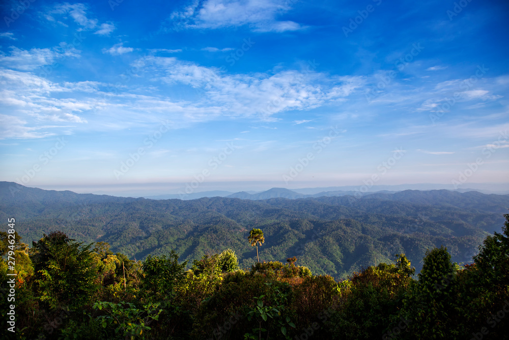 Mountains view landscape in rain forest with blue sky. Beautiful scenery view in countryside of asia.