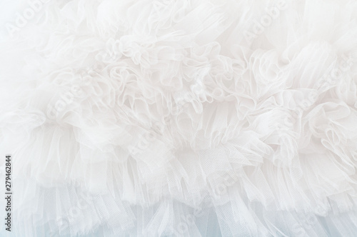White tule background with soft ruffled fabric  photo