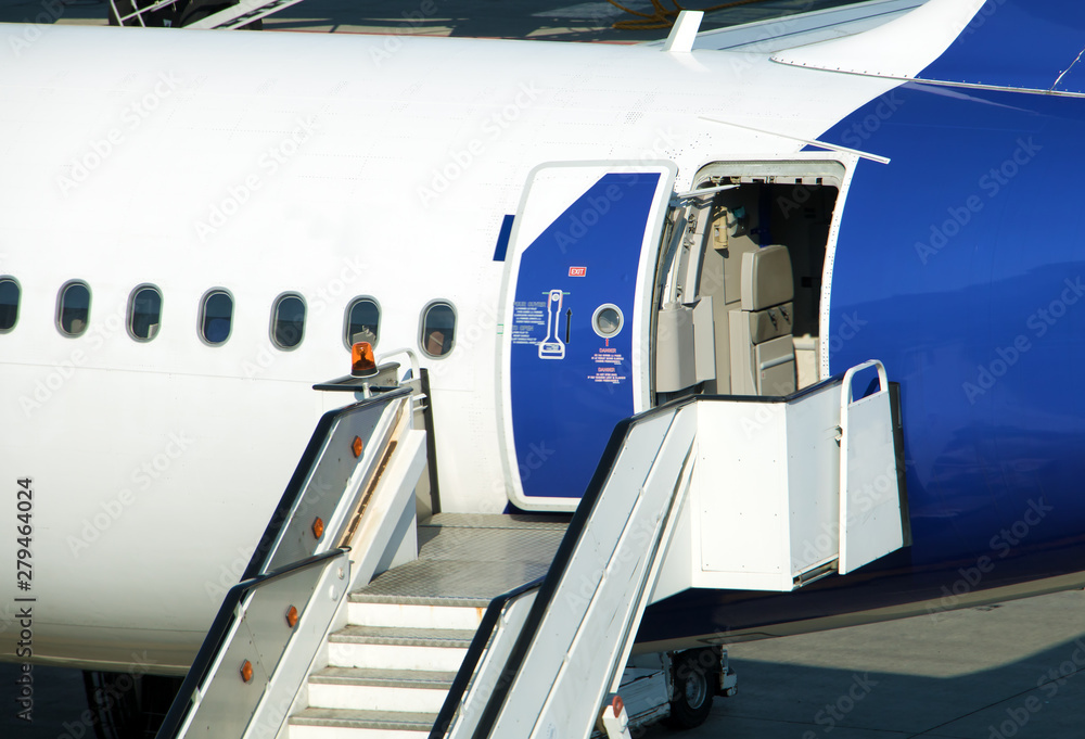 A stairs are ready under the open rear door of the aircraft, after landing. A stairs are ready under the open rear door of the aircraft, after landing.