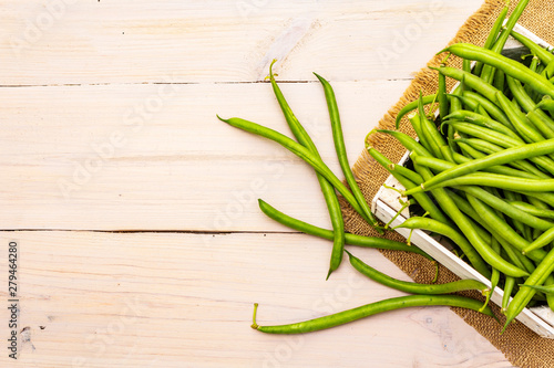 Phaseolus vulgaris  green common bean or kidney bean in wooden box