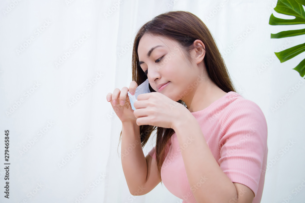 Woman suffer from cough with face mask protection.