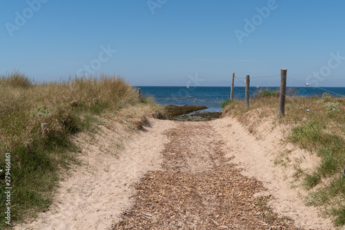 access beach of isle Noirmoutier by sand pathway in Vendee France