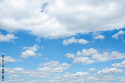 A cloudy blue sky with horizontal perspective and diffuse clouds in the bottom and dense in the top