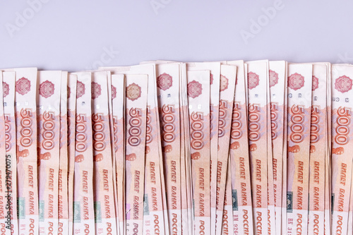 Russian money, five-thousandth bills on a gray background, top view