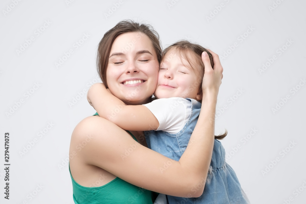 Woman hugging her cute child baby girl. Mother Day love family, parenthood childhood concept Woman hugging her cute child baby girl. Mother Day love family, parenthood childhood concept