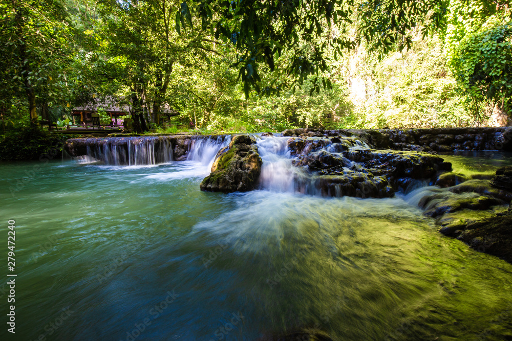 Naklejka premium Waterfall in deep tropical rain forest Sra Bok Karanee in Phang Nga