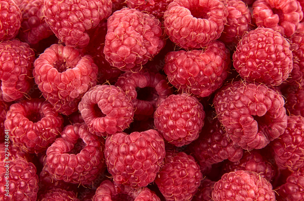 Delicious fresh and sweet red raspberries as food background. Healthy food organic nutrition. The view from the top. Delicious fresh and sweet red raspberries as food background. Healthy food organic nutrition. The view from the top.