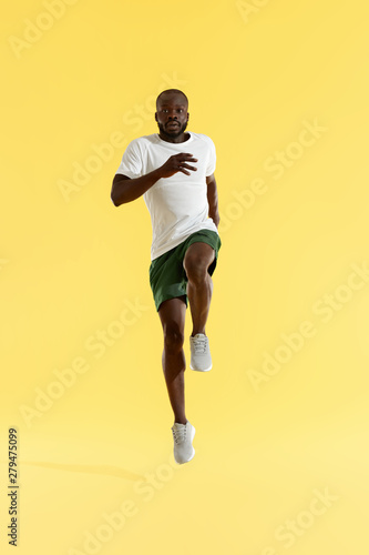 Workout. Sports man exercising, running on spot, cardio training