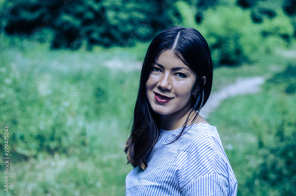 portrait of young gorgeous happy brunette in the park portrait of young gorgeous happy brunette in the park