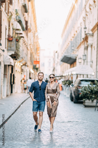 Happy couple at sunset in Italy. Evening summer photo shoot in Rome. © pavelvozmischev