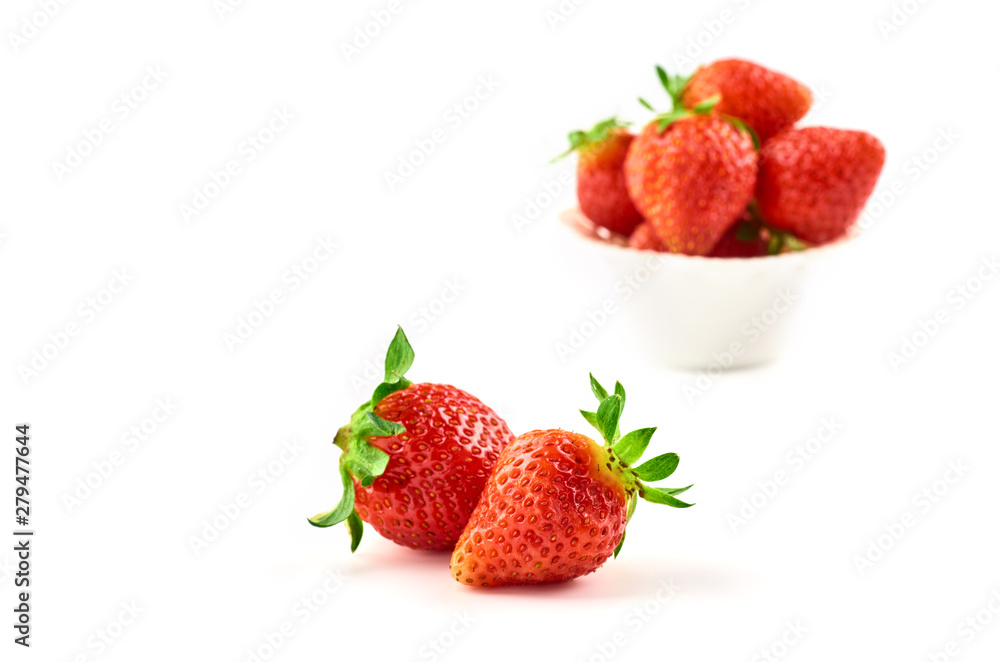 Strawberry berries on a saucer isolated on a white background. Strawberry berries on a saucer isolated on a white background.