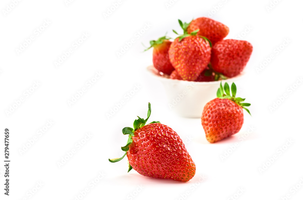 Strawberry berries on a saucer isolated on a white background. Strawberry berries on a saucer isolated on a white background.