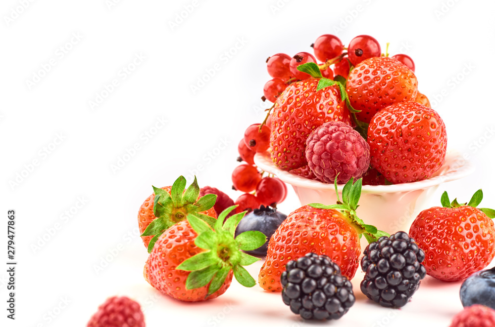 Composition of strawberries, blackberries, blueberries, raspberries and red currants on a white background. Composition of strawberries, blackberries, blueberries, raspberries and red currants on a white background.