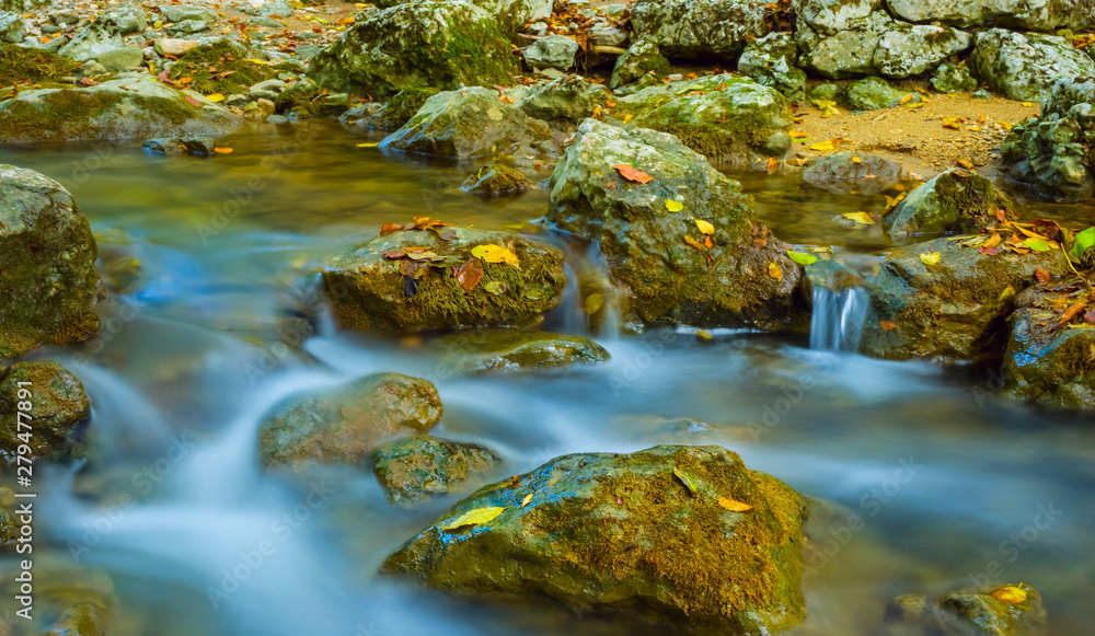 mountain canyon scene, small river among a stones mountain canyon scene, small river among a stones